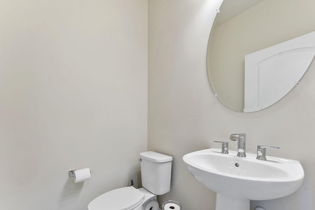 bathroom featuring sink and toilet