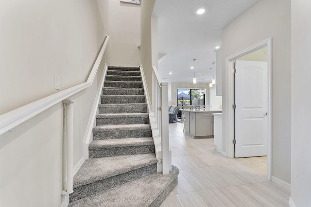 stairs with tile patterned floors