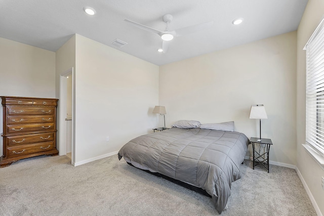 bedroom featuring light carpet and ceiling fan