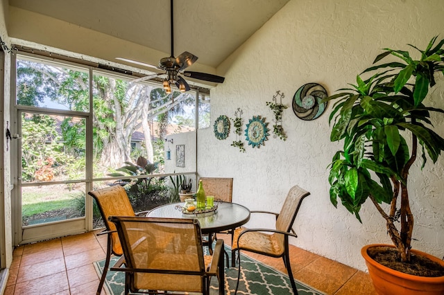 sunroom / solarium with ceiling fan and a healthy amount of sunlight