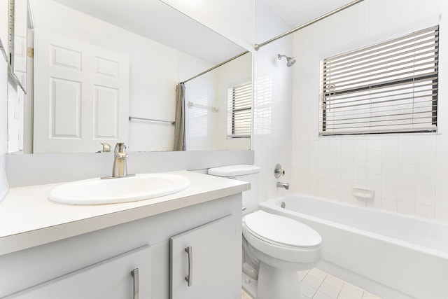 full bathroom featuring vanity, toilet, and tiled shower / bath