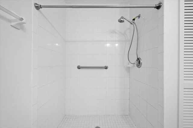 bathroom with a tile shower