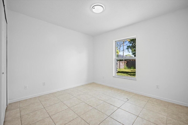 spare room with a textured ceiling