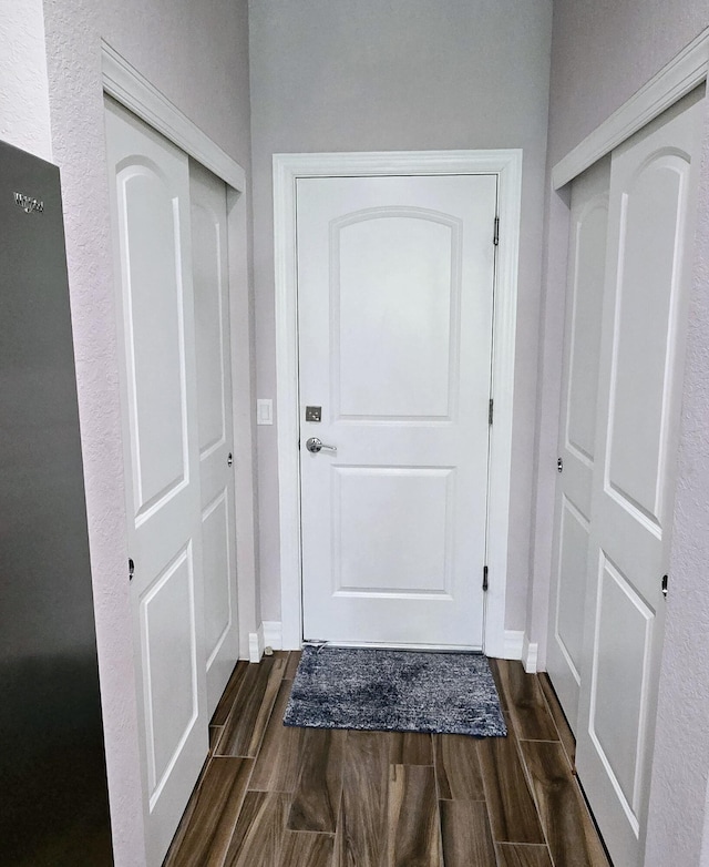 4582 San Fratello Cir, Lake Worth, FL 33467 - doorway to outside with dark wood-style floors and baseboards