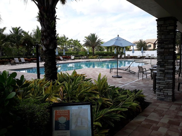4582 San Fratello Cir, Lake Worth, FL 33467 - community pool with a patio area
