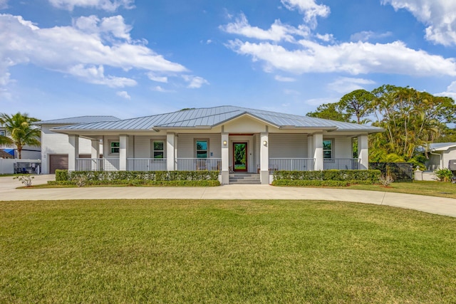 view of front facade with a front lawn and a porch