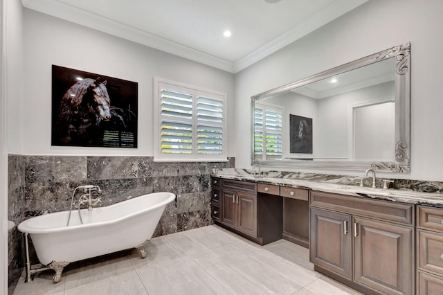 bathroom featuring tile walls, ornamental molding, vanity, tile patterned flooring, and a washtub