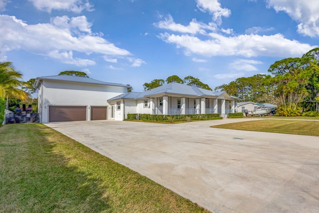 ranch-style house with a garage, a front lawn, and a porch