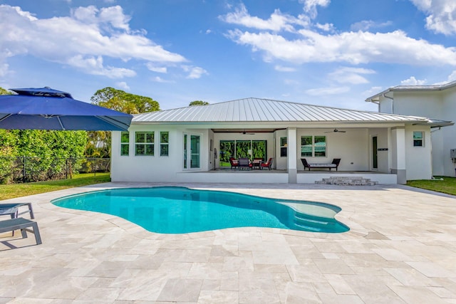 view of pool featuring a patio and ceiling fan