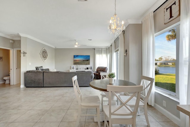 dining room with crown molding, ceiling fan with notable chandelier, light tile patterned flooring, and a water view