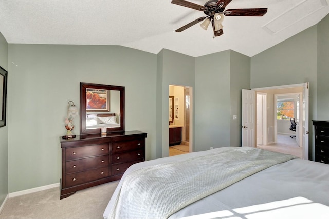 bedroom with light carpet, vaulted ceiling, connected bathroom, and ceiling fan