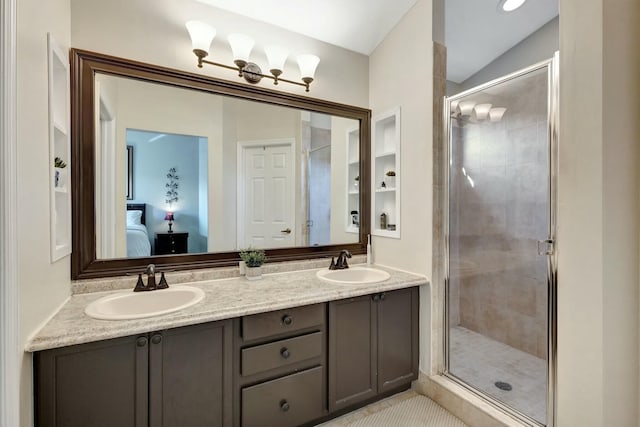 bathroom featuring vanity, an enclosed shower, and lofted ceiling