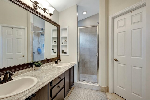 bathroom with tile patterned floors and vanity