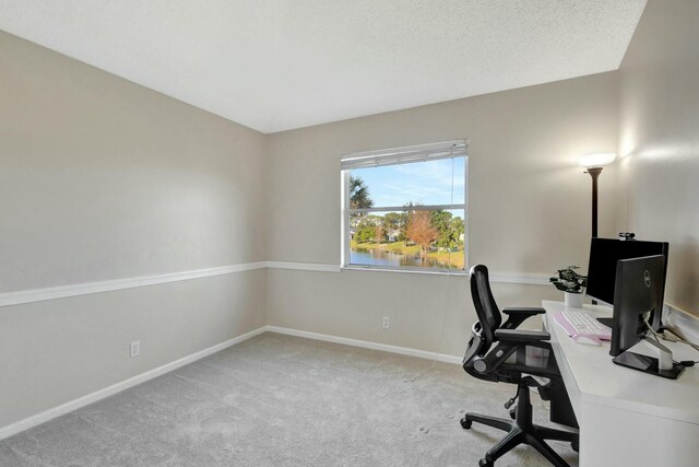 carpeted bedroom with ceiling fan, vaulted ceiling, and a textured ceiling