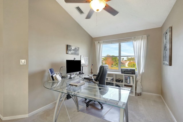 home office with high vaulted ceiling, ceiling fan, and light colored carpet