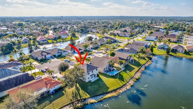 birds eye view of property with a water view