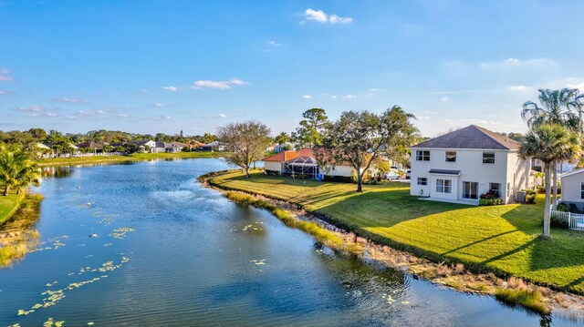 drone / aerial view with a water view