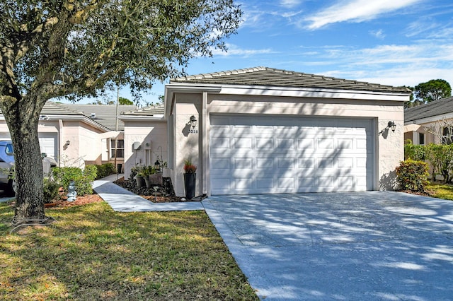 view of front facade with a garage and a front lawn