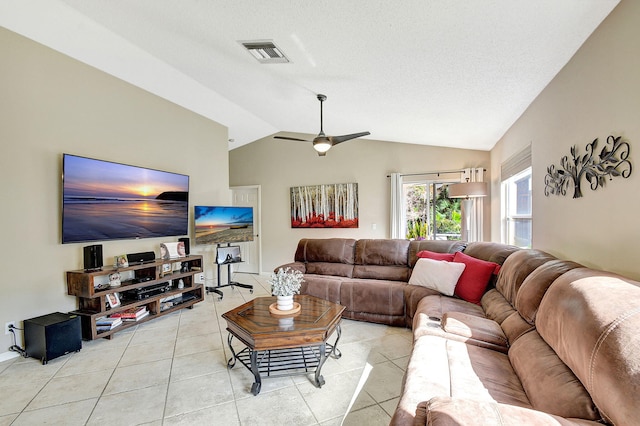 tiled living room with ceiling fan and lofted ceiling