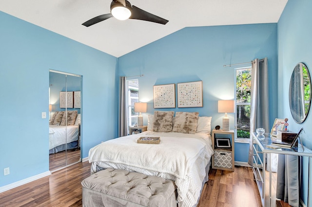 bedroom featuring dark hardwood / wood-style flooring, vaulted ceiling, and ceiling fan