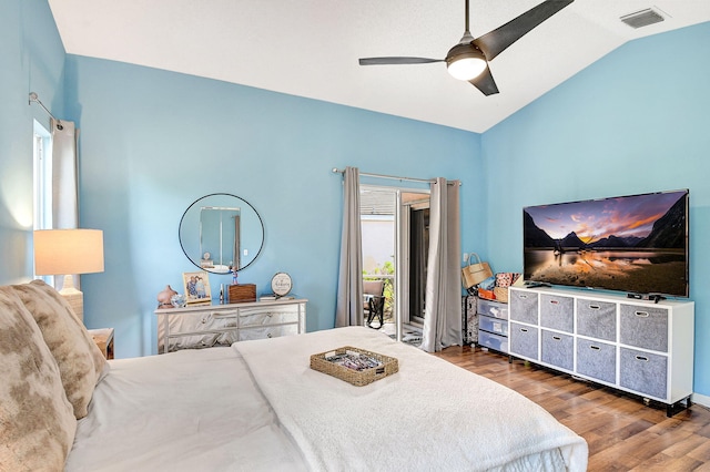 bedroom featuring lofted ceiling, access to exterior, dark hardwood / wood-style floors, and ceiling fan