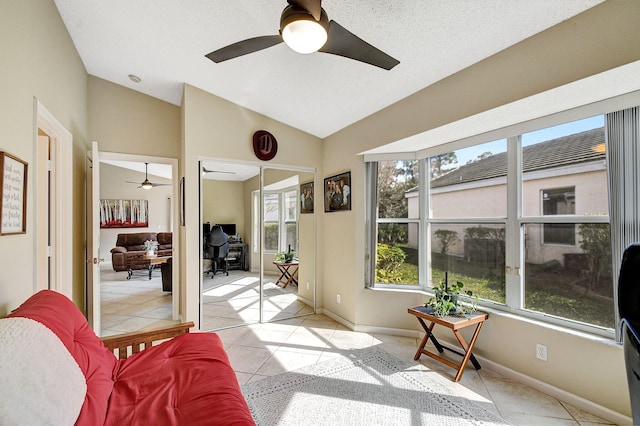 interior space with ceiling fan and vaulted ceiling