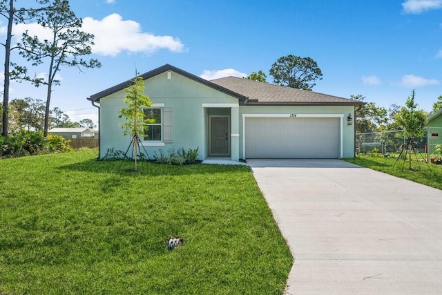 single story home featuring stucco siding, an attached garage, concrete driveway, and a front lawn