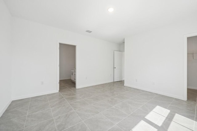 empty room featuring baseboards