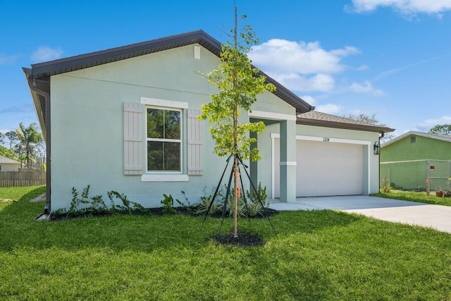 single story home featuring fence, stucco siding, concrete driveway, a front lawn, and a garage