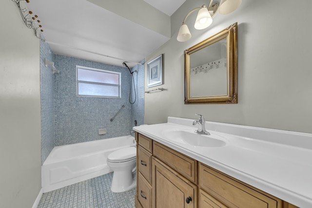 full bathroom featuring tile patterned flooring, vanity, tiled shower / bath combo, and toilet