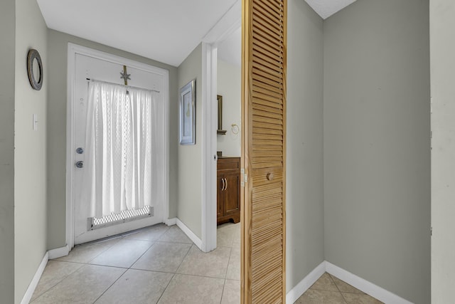 entrance foyer with light tile patterned floors