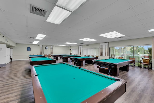 game room with pool table, wood-type flooring, and a paneled ceiling