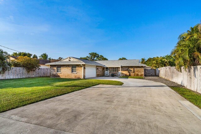 ranch-style house with a front lawn