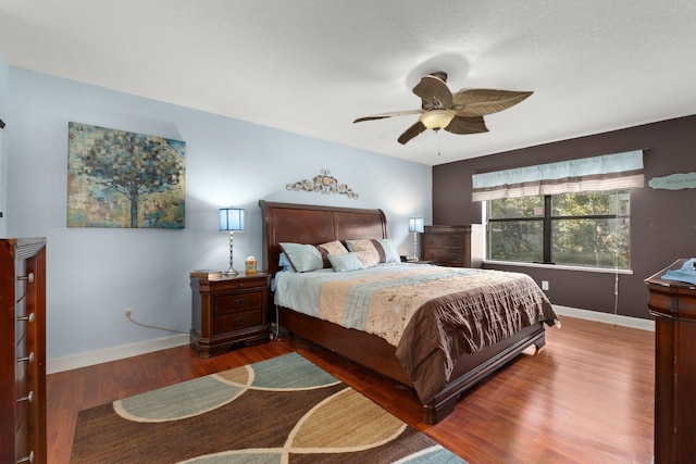 bedroom featuring ceiling fan and hardwood / wood-style floors