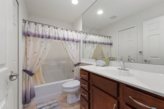 full bathroom featuring vanity, shower / tub combo, tile patterned floors, and toilet