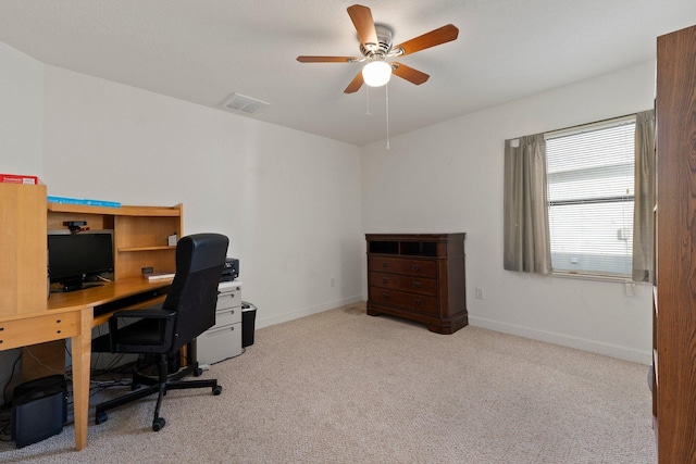 office space featuring light colored carpet and ceiling fan