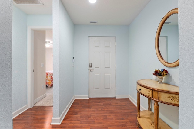 entrance foyer with dark hardwood / wood-style floors