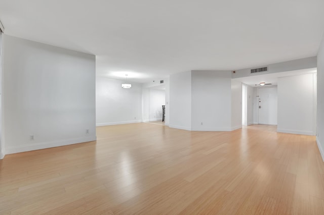 spare room featuring light wood-type flooring