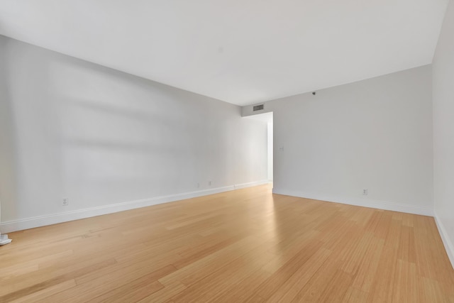 empty room with light wood-type flooring