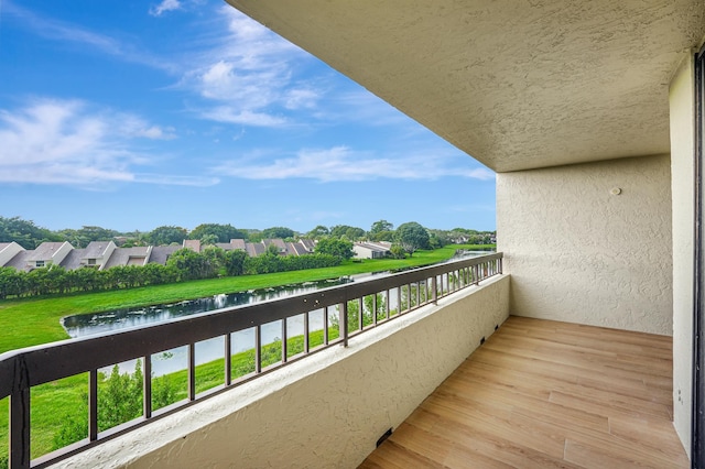 balcony featuring a water view