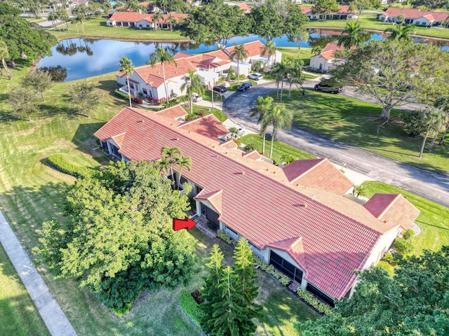 birds eye view of property with a water view