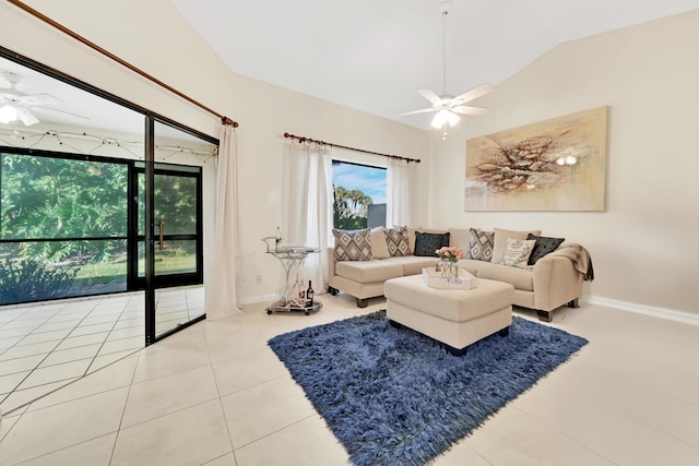 living room with tile patterned flooring, vaulted ceiling, and ceiling fan