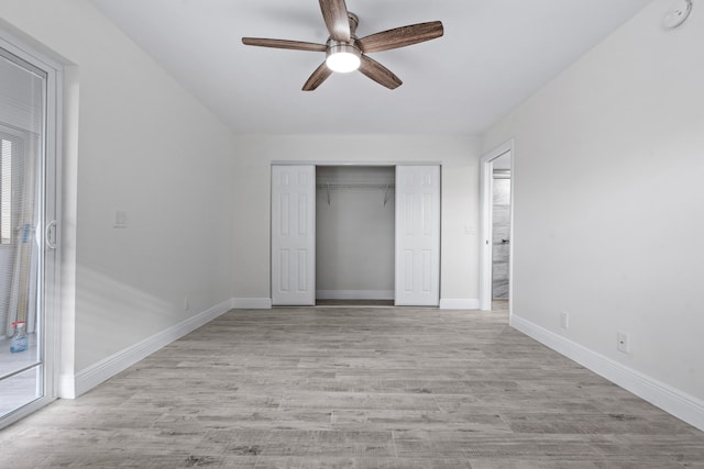 unfurnished bedroom with ceiling fan, a closet, and light wood-type flooring