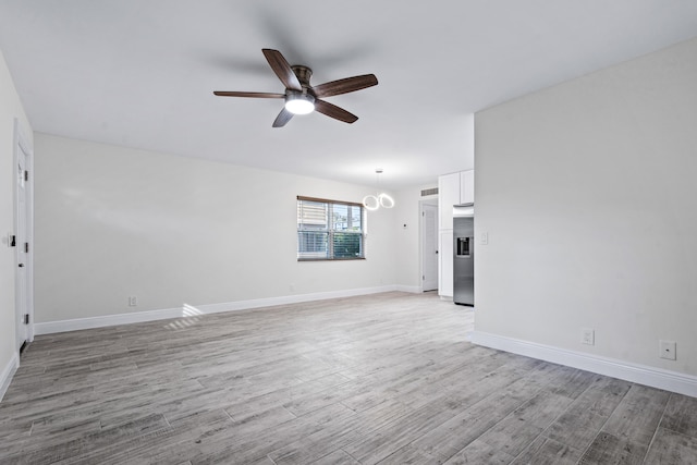 interior space featuring ceiling fan and light hardwood / wood-style floors