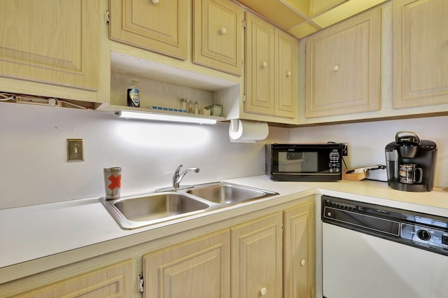 kitchen featuring sink, dishwasher, and light brown cabinets