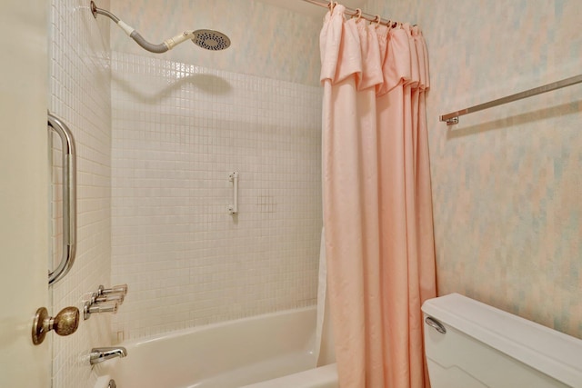 bathroom featuring toilet and shower / bath combo with shower curtain