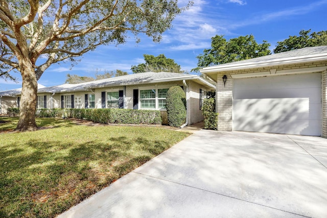 ranch-style home with a garage and a front yard