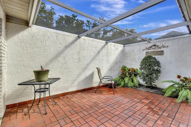 view of patio / terrace with a lanai