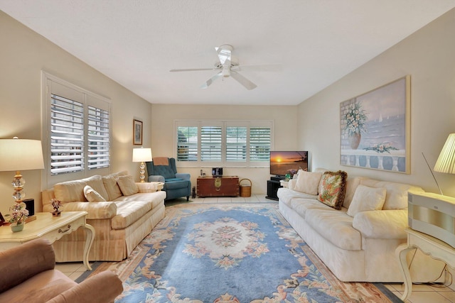 tiled living room with ceiling fan