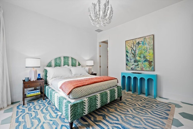 bedroom featuring an inviting chandelier